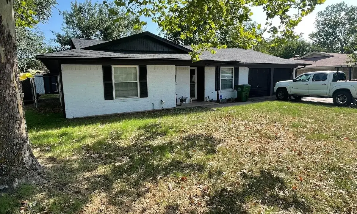 Professional roofing crew working on a residential roof in Waimalu